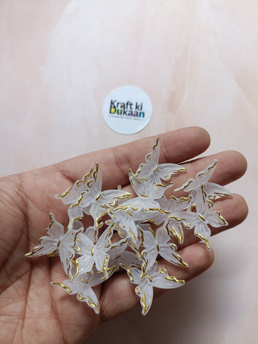 Butterfly bead pack of 25, gold-tone wing charms with white insets