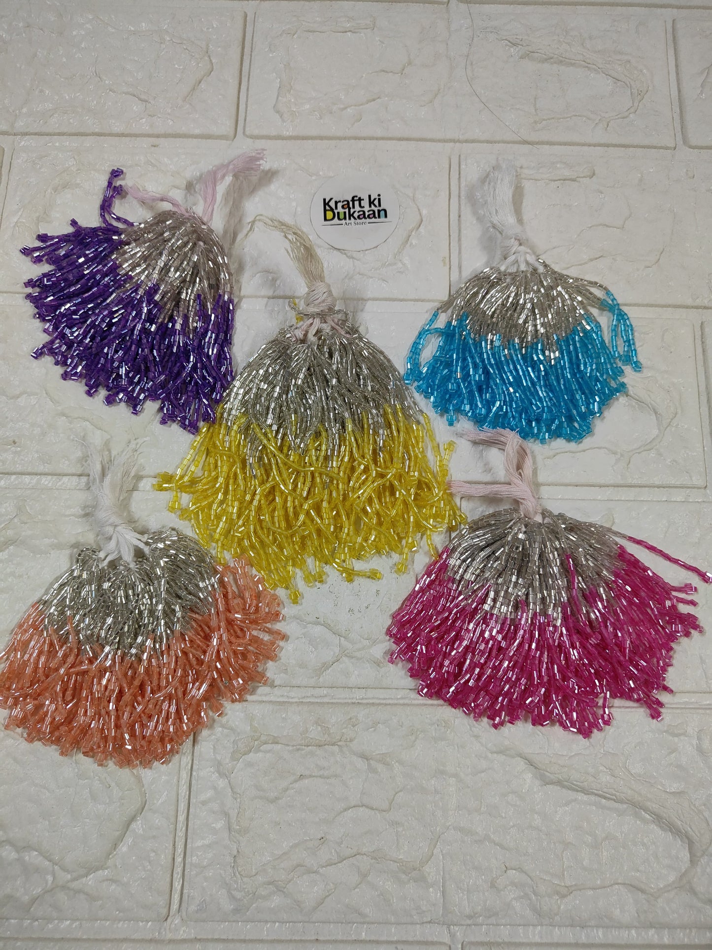 Set of 10 metallic latkan tassels in purple, silver, yellow, orange, blue and pink