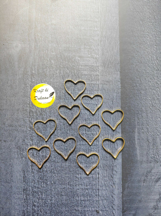 Heart designer bezel 10-piece set with gold-tone heart frames, laid out flat