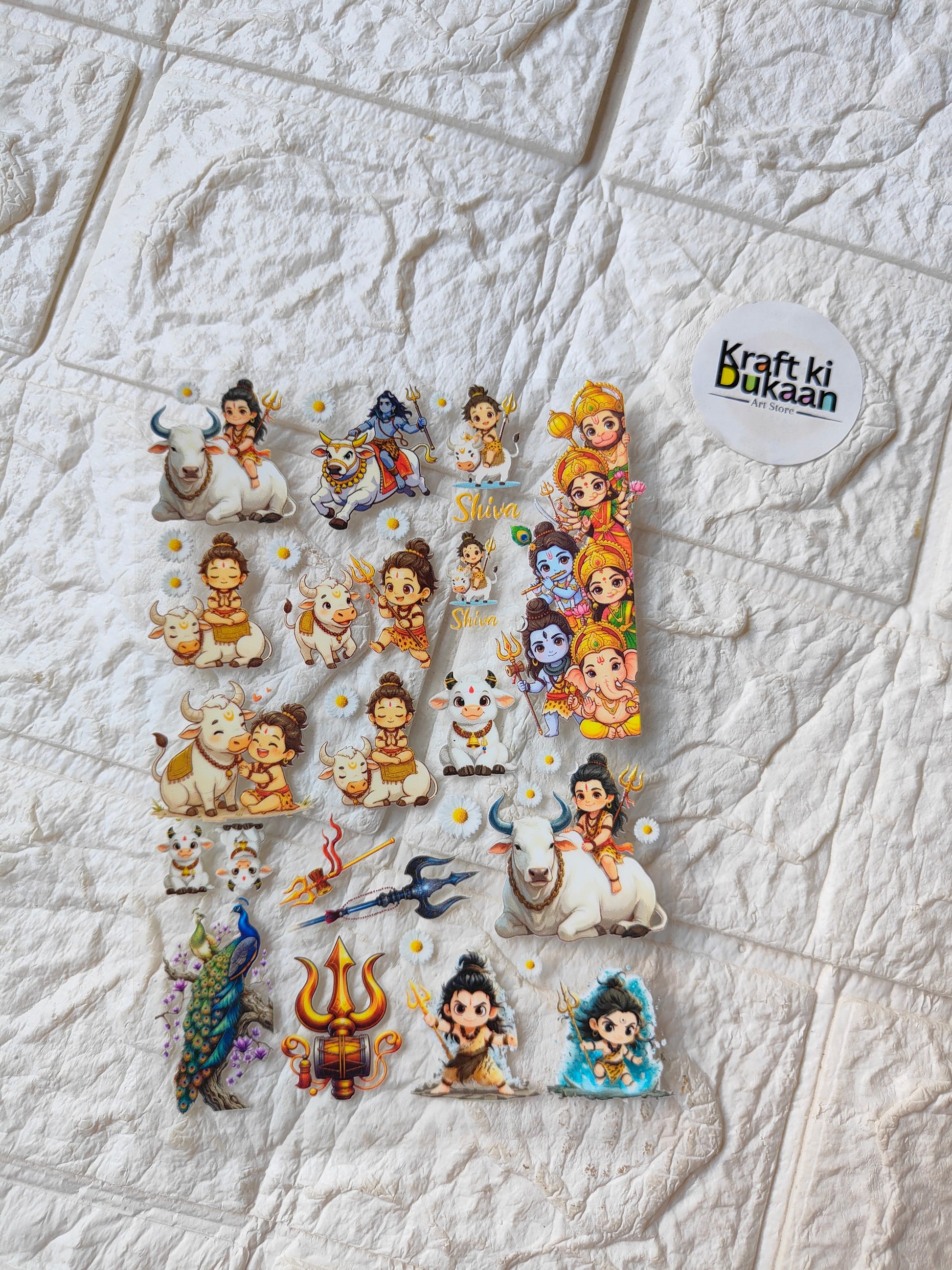 UV DTF peel-off sticker sheet with cartoon characters, blue accents, 'Kraft ki Dukaan' logo