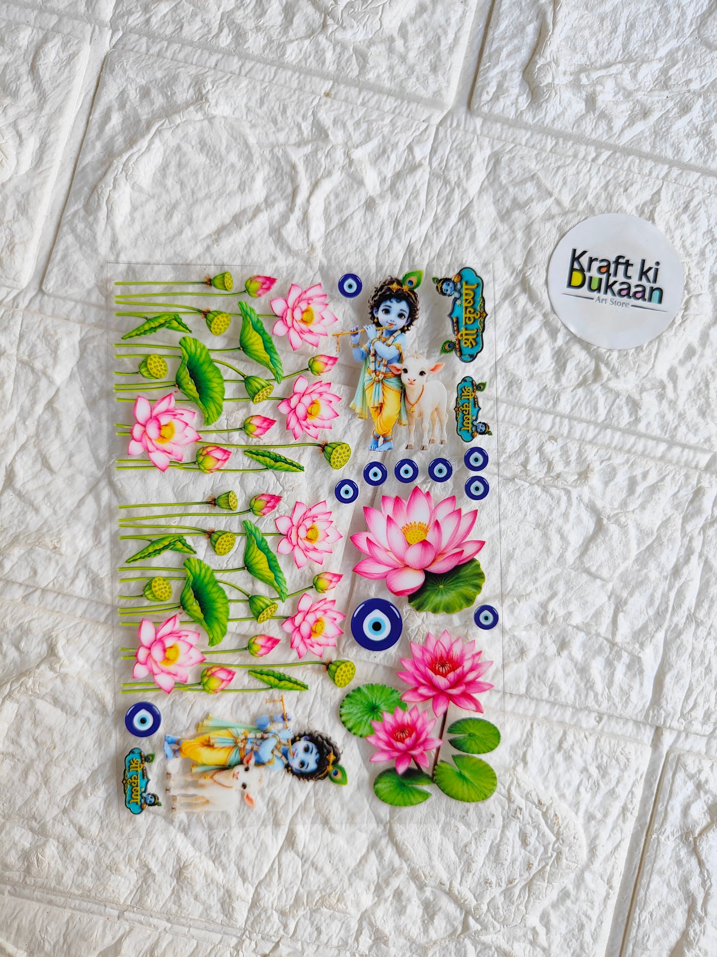 Peel-off sticker sheet with pink lotus flowers, green leaves, blue eye motifs