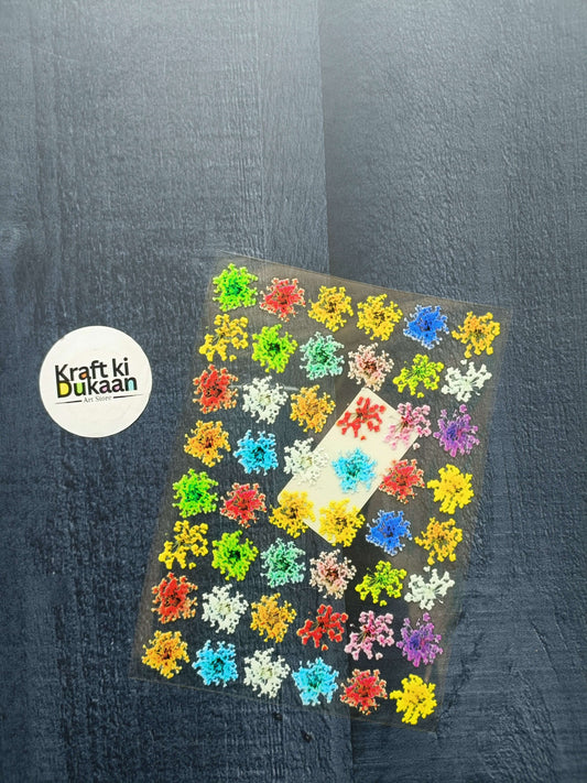 Peel-off sticker sheet with multicolor floral snowflake-like decals, sheet view