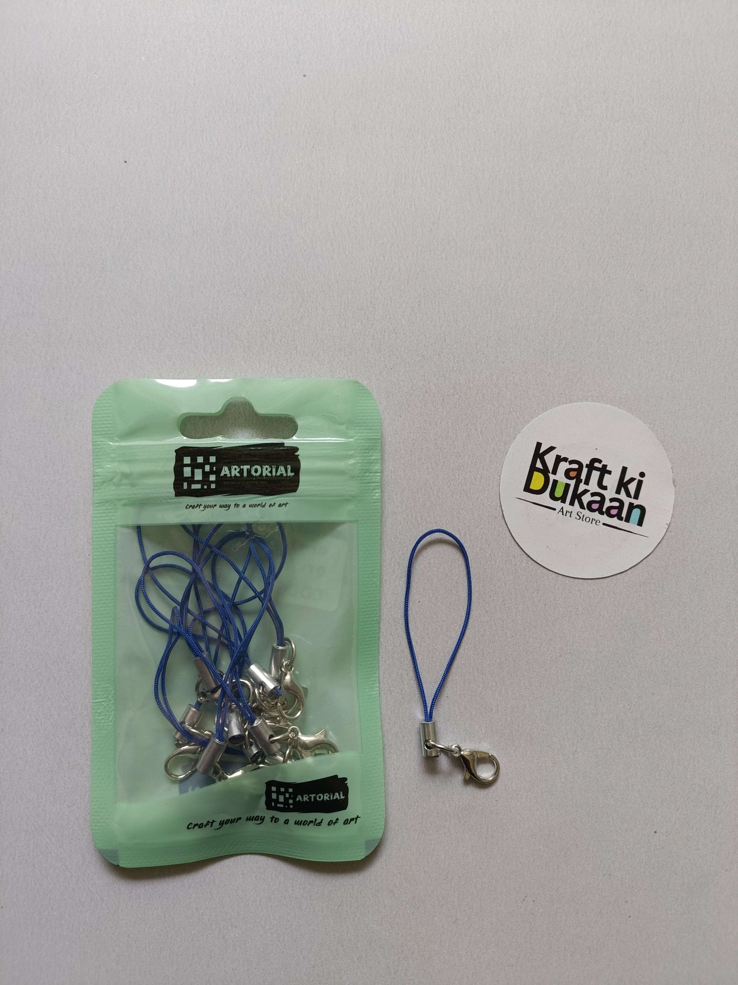 Sea green pouch keychain set with blue rope and silver lobster clasps, loose cord