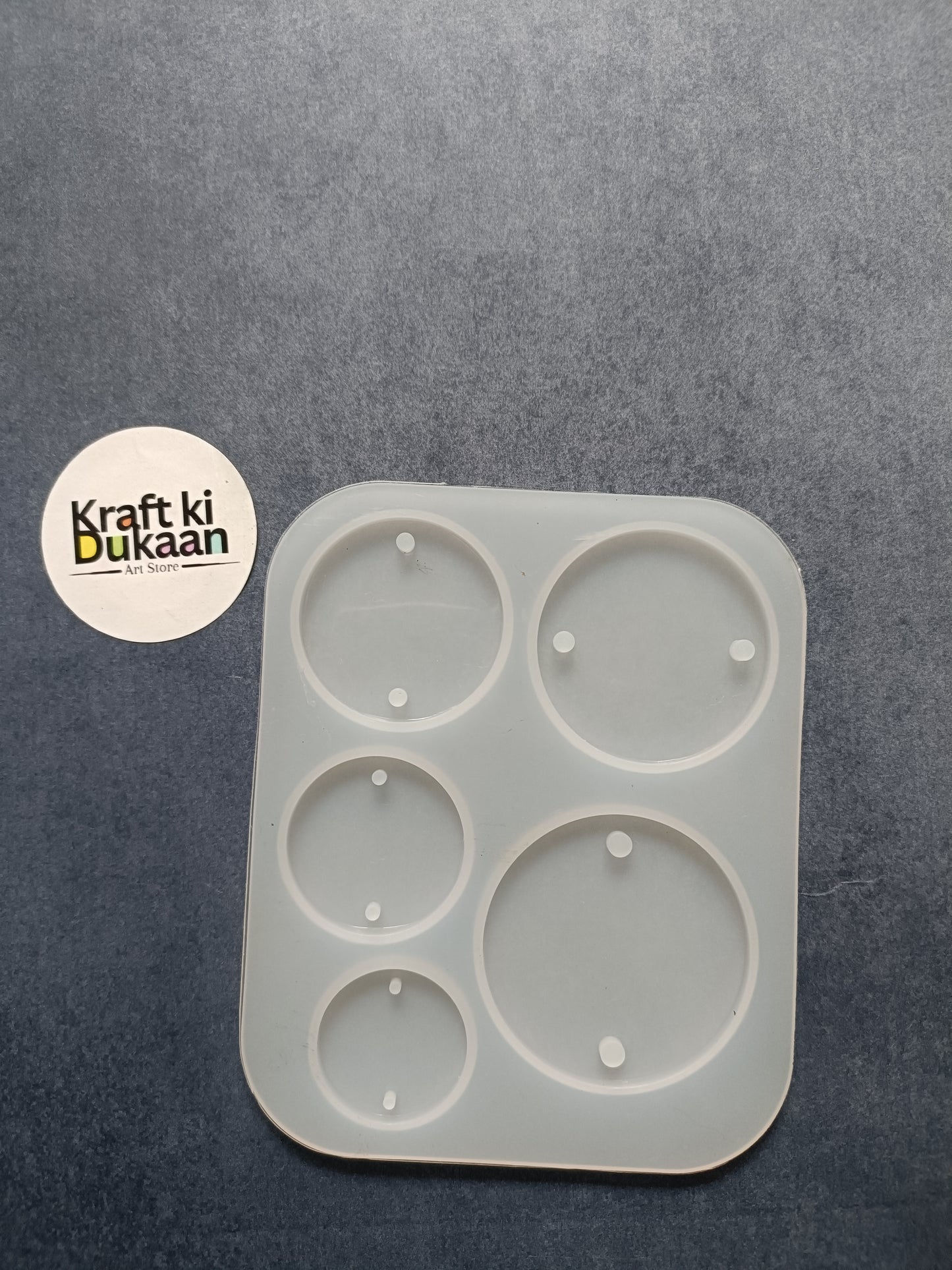 Five-cavity round rakhi mould, white square tray with five circular wells