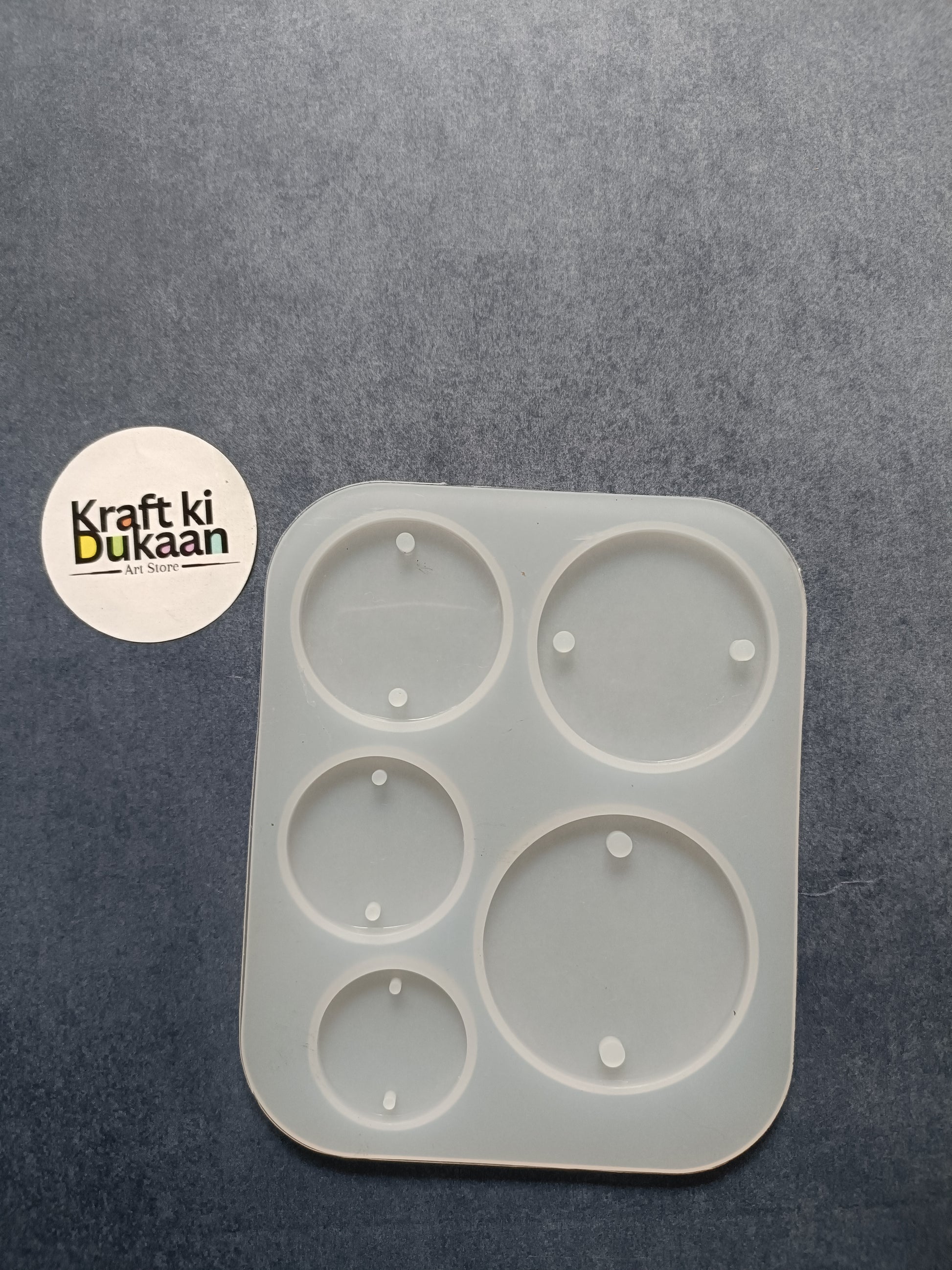 Five-cavity round rakhi mould, white square tray with five circular wells