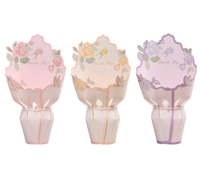 Three pastel floral cardboard flower wraps, pink, peach, and purple, scalloped design