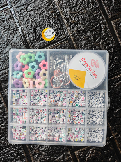 DIY bracelet beads kit: clear divided box with letter and flower beads, cord and clasps