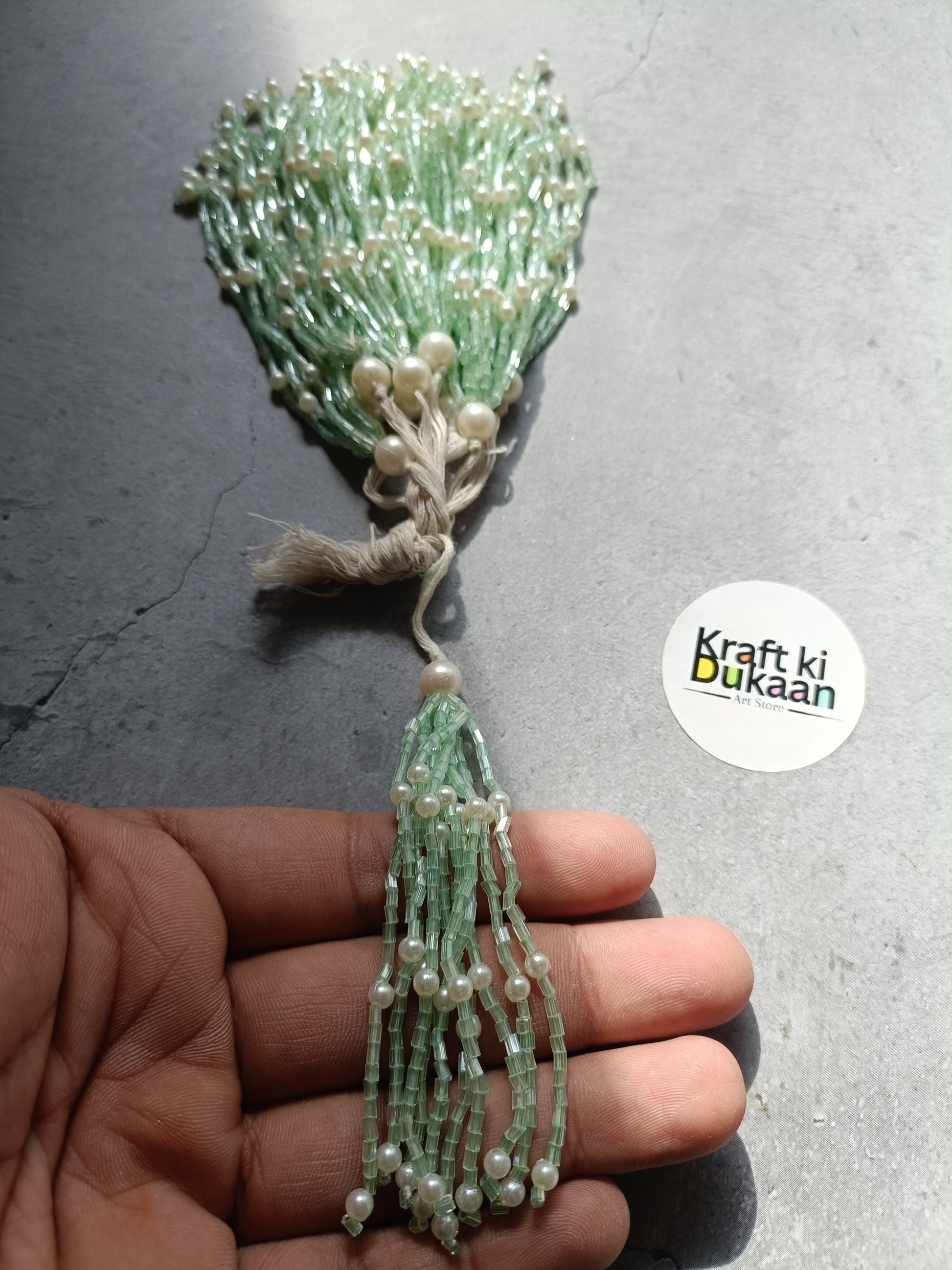 Green beaded tassel latkan charm with pearl beads and hanging loop