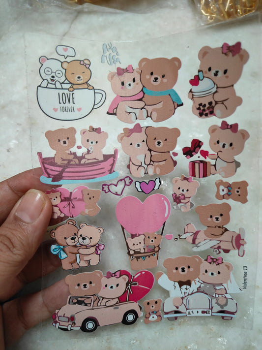 Peel-off sticker sheet with cute bear characters, hearts, and small scenes