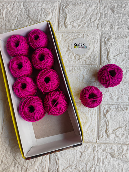 Rakhi thread spool set in magenta pink, open box with several thread balls