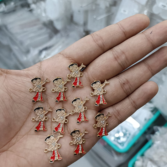 10 gold-tone rakhi bracelet pendant charms, cartoon figures with red enamel outfits