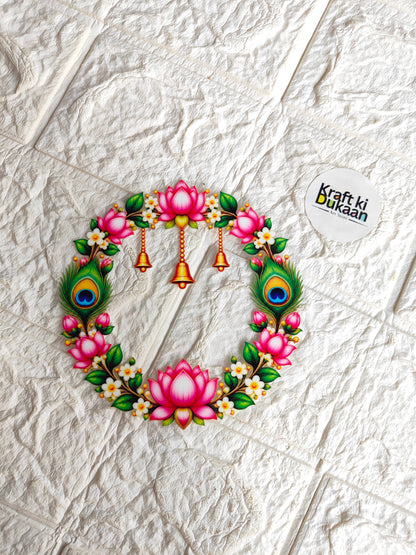 Round peel-off sticker showing pink lotus wreath with peacock-feather details and bells