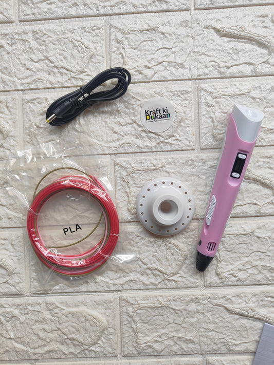 3D pen kit with pink pen, red PLA filament spool, white base, and charging cable
