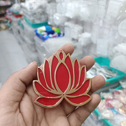 Red lotus acrylic tea light holder with gold trim, shown in hand