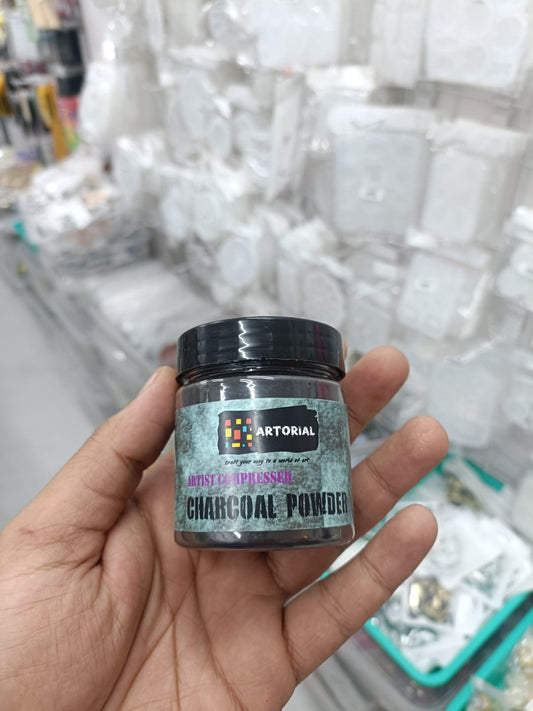 Charcoal powder jar in dark glass container with black screw lid