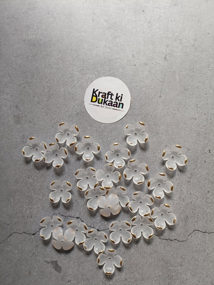 White flower beads, scattered display of petal-shaped beads; pack of 50