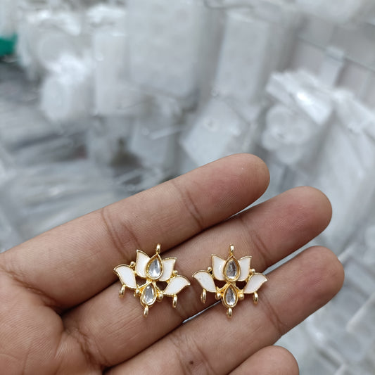 Gold-tone lotus kundan stud earrings with clear teardrop stones and small bead accents