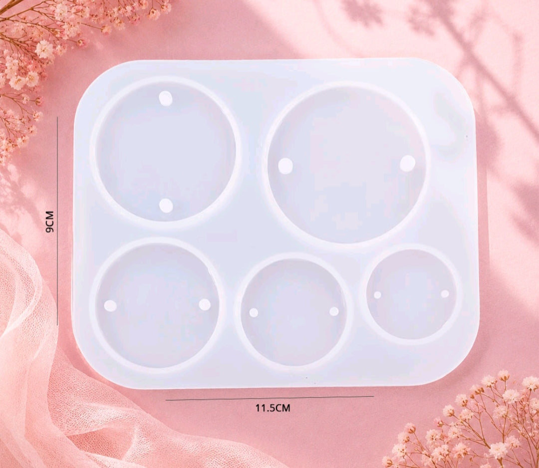 White plastic five-cavity round rakhi mould with circular impressions