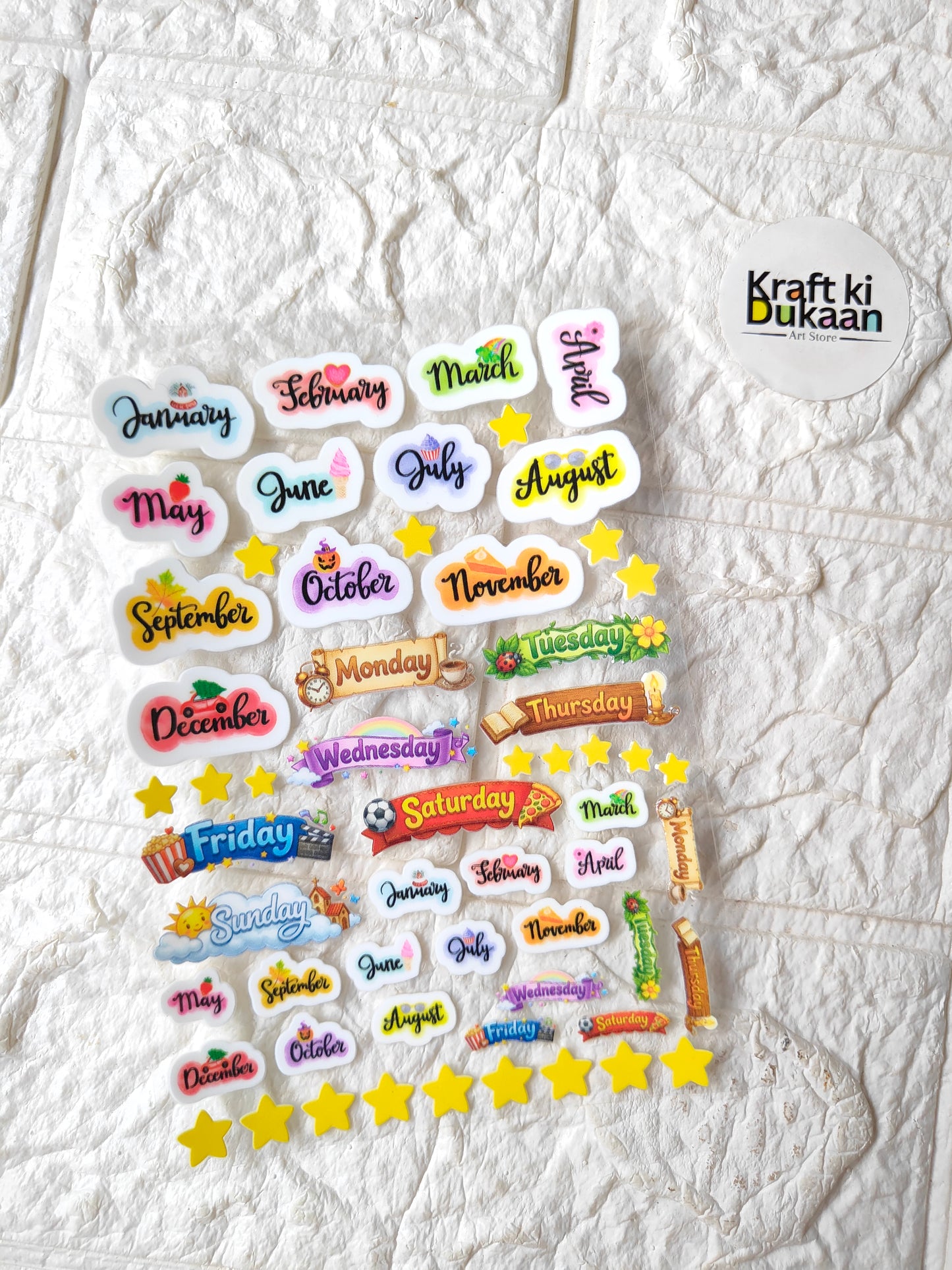 Colorful calendar sticker sheet with month and day names, stars, peel-off labels