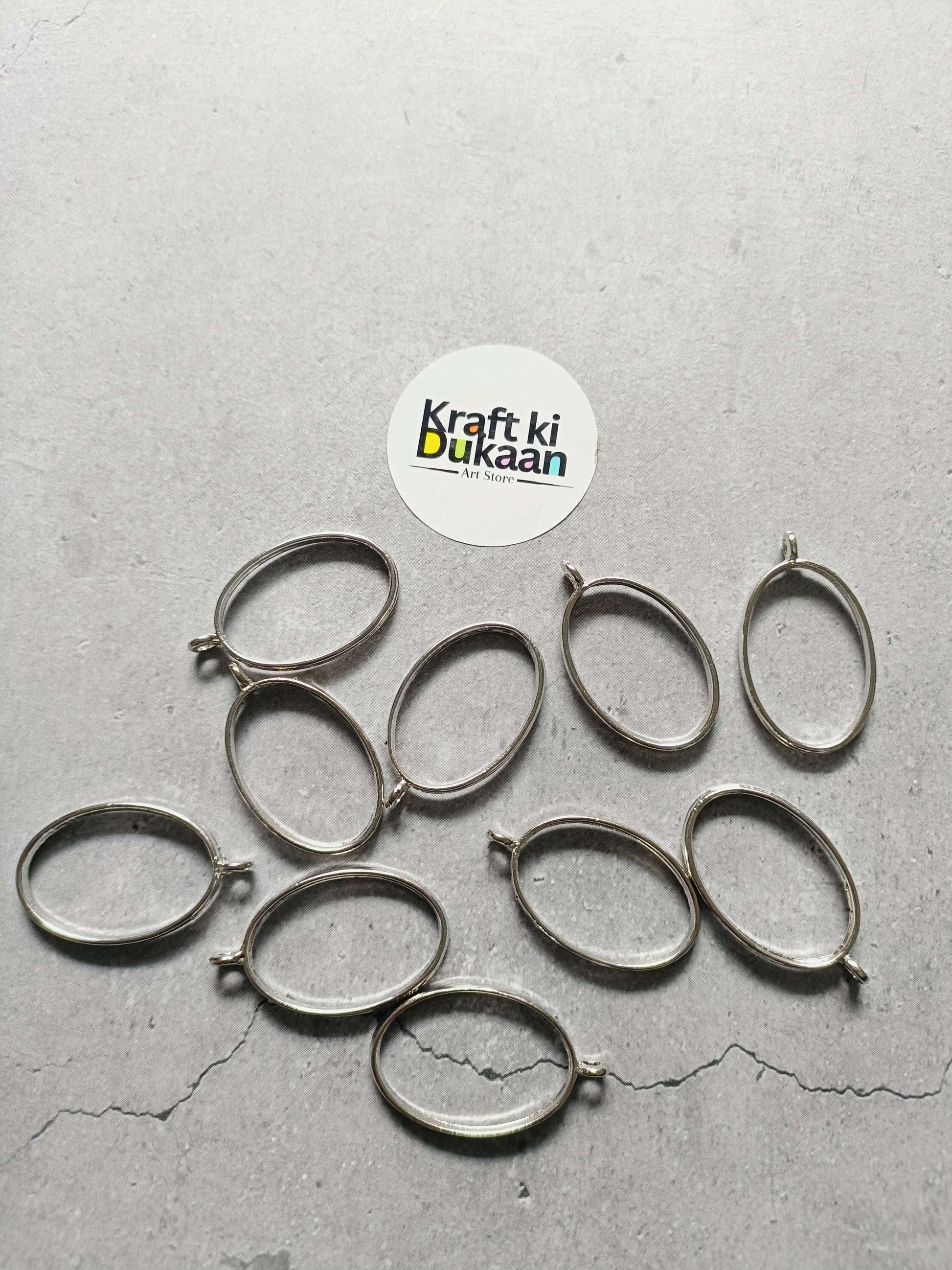 Silver oval bezel pendant set of 10, plain linked frames with small eye hooks