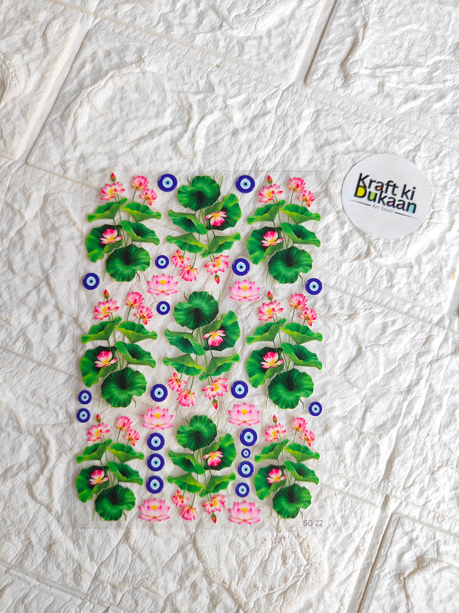 Peel-off sticker sheet with pink flowers, green leaves, and blue eye motifs