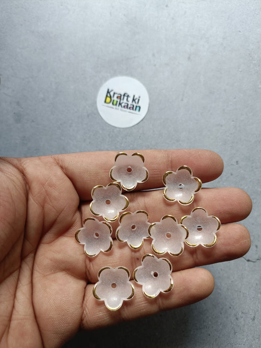 5-petal flower bead set with gold-tone rings, 50 count, in hand