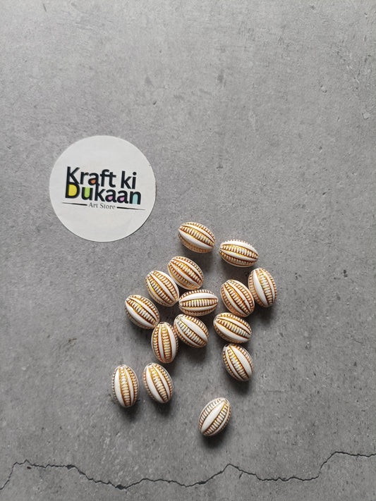 Rakhi bracelet bead set, oval striped beads scattered on surface, 25 beads