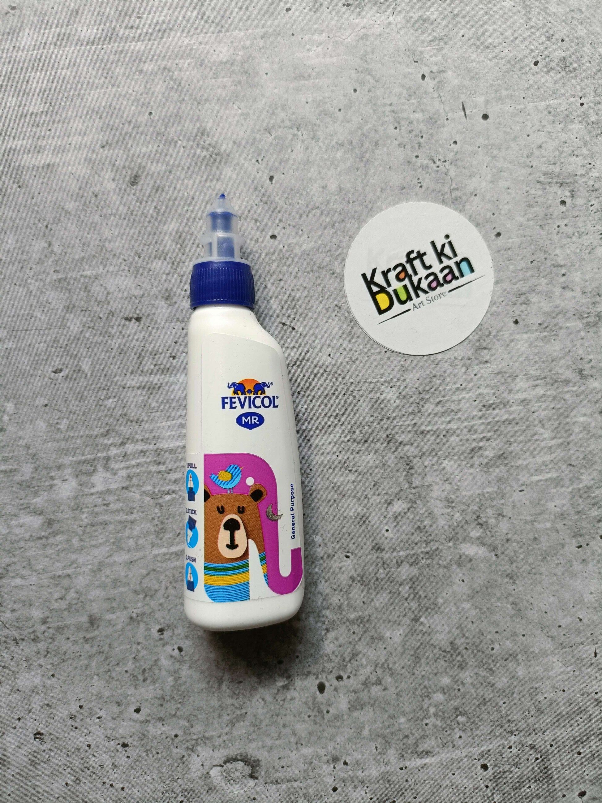 Fevicol MR white glue bottle with blue cap, bear illustration on front
