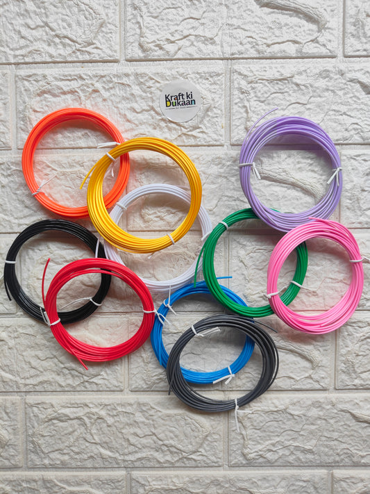 3D pen filament pack with assorted color coils: red, yellow, purple, blue, black, pink, green.