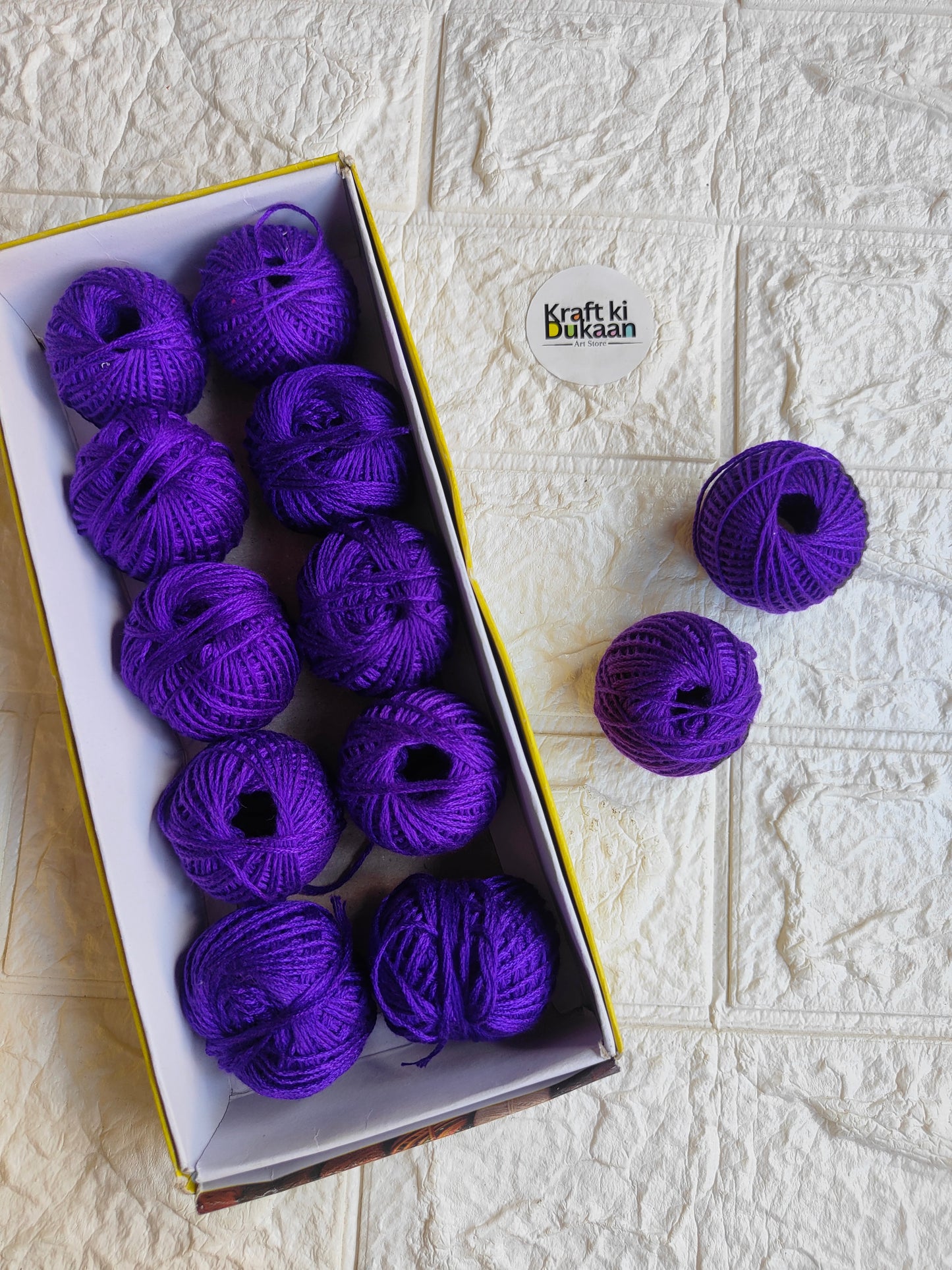 Rakhi thread spool set in dark purple, box with multiple spools and loose threads