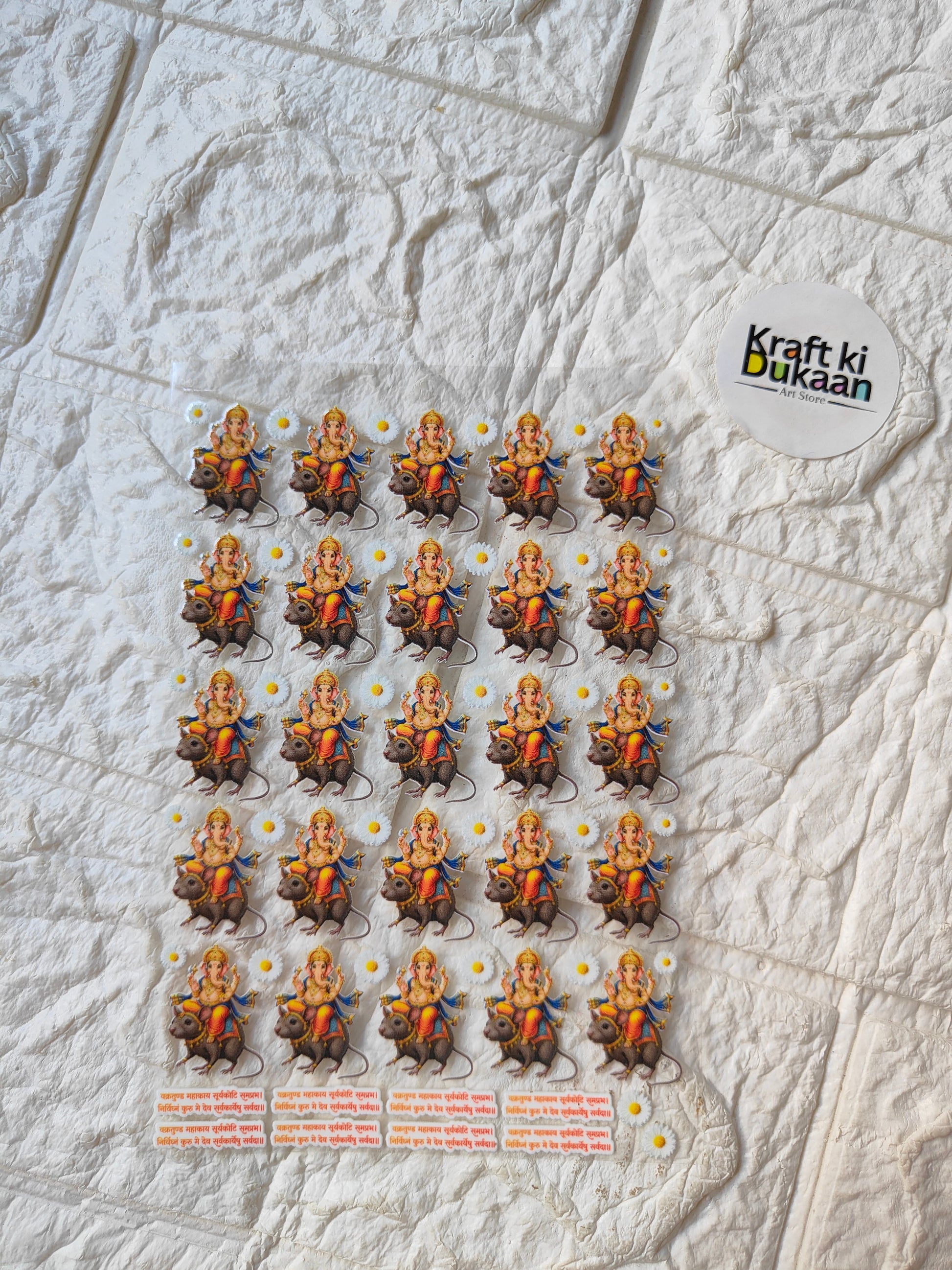 Peel-off sticker sheet with multiple small orange and gray cartoon figures