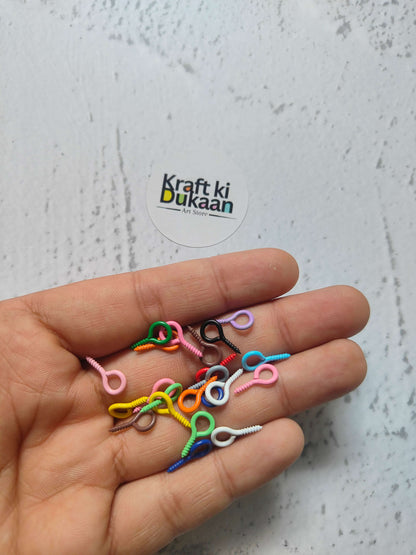Multicolor eye screw hooks with looped eye and spiral screw points (close-up)