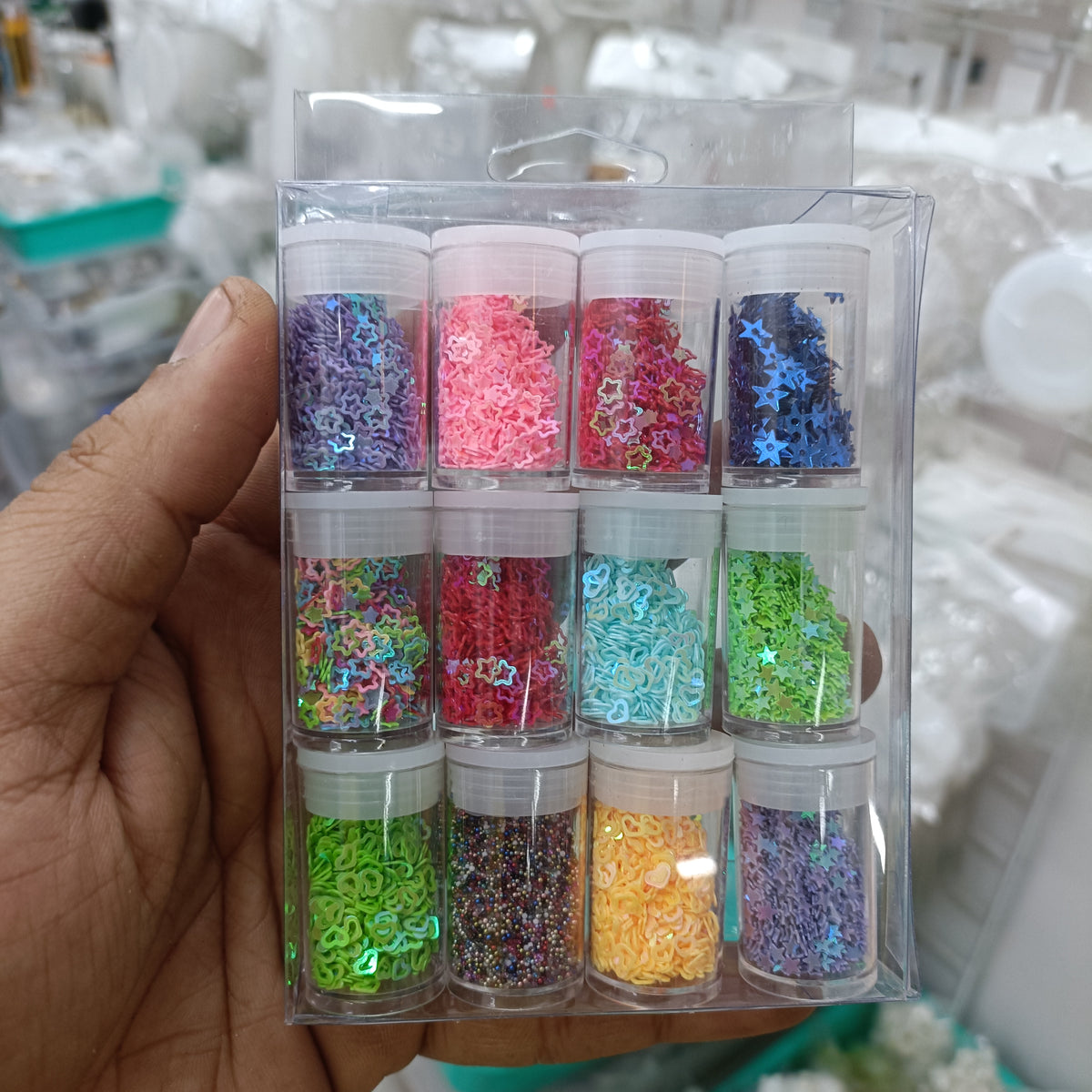 Assorted PVC sequin set in clear organizer, multiple colors and shapes