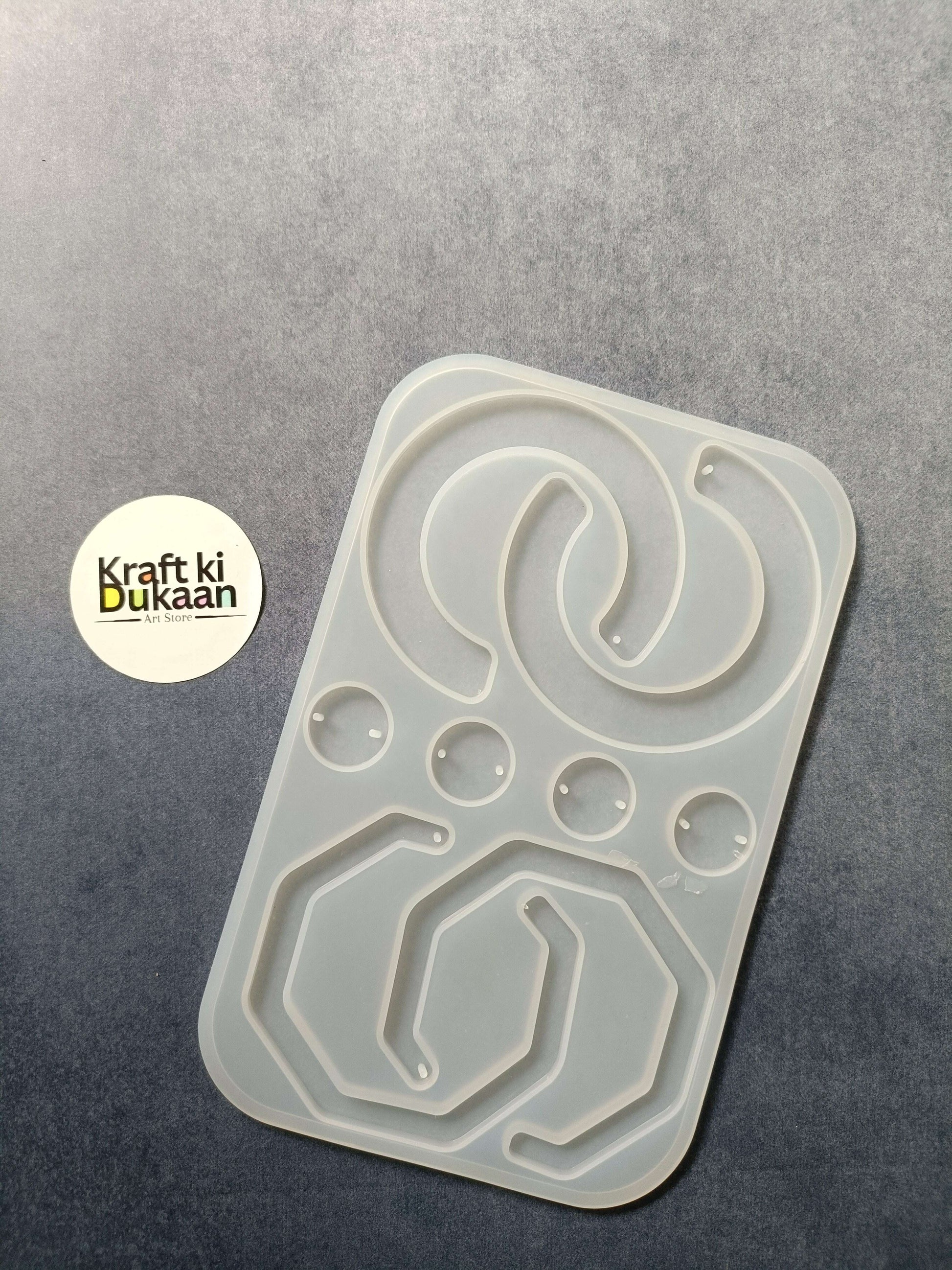 8-cavity silicone jewelry mould with shaped resin cavities, including heart and oval designs