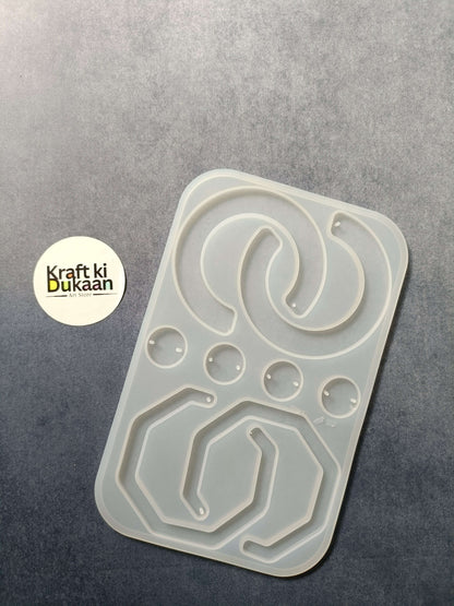 8-cavity silicone jewelry mould with shaped resin cavities, including heart and oval designs