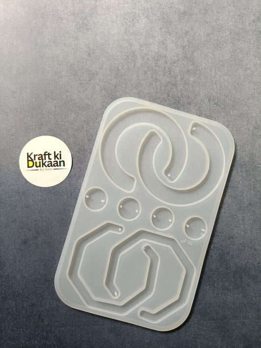 8-cavity silicone jewelry mould with shaped resin cavities, including heart and oval designs