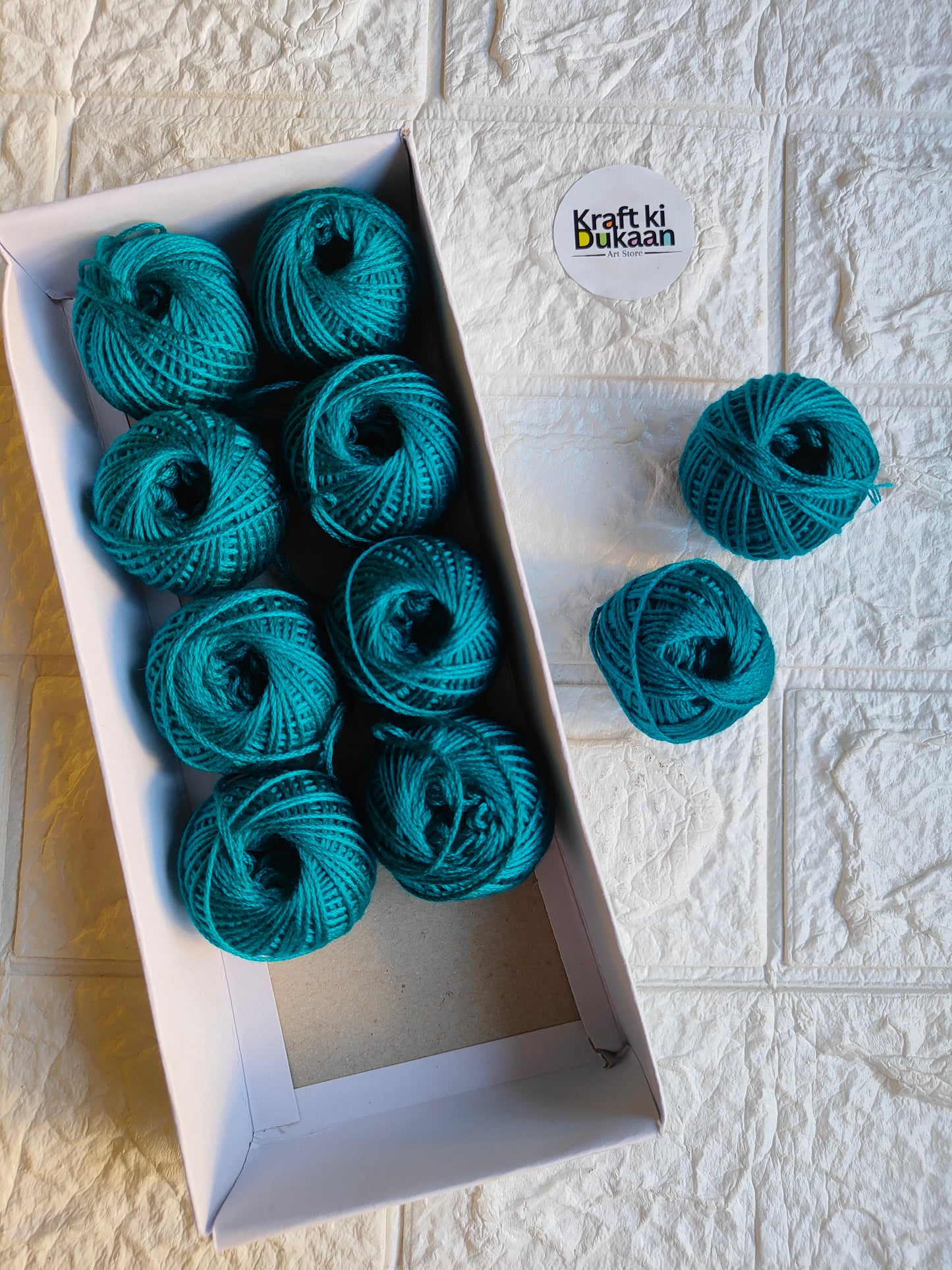 Rakhi thread roll set, turquoise-blue yarn balls with loose thread ends