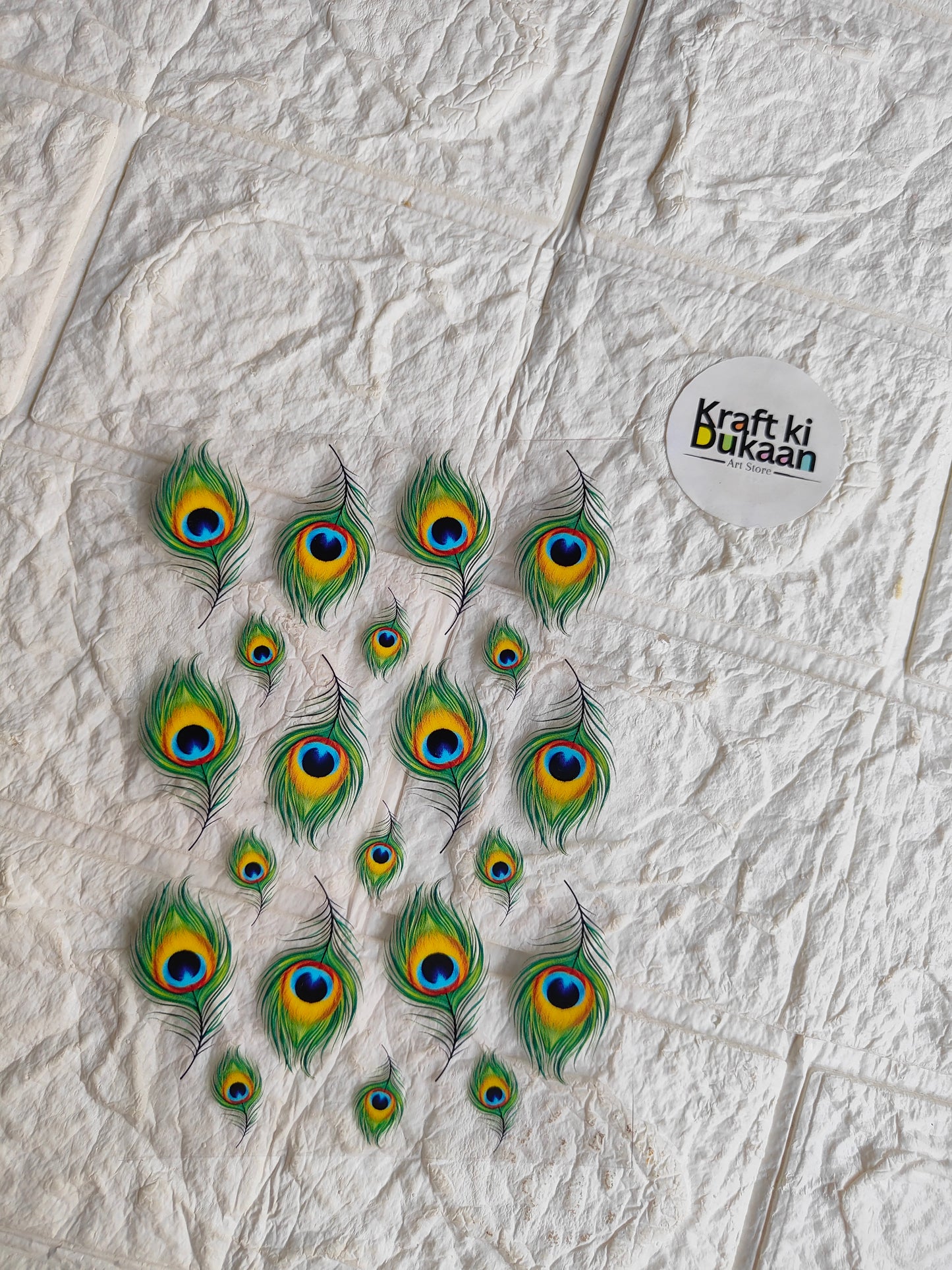 UV DTF peel-off sticker sheet with peacock feather designs, small oval decals