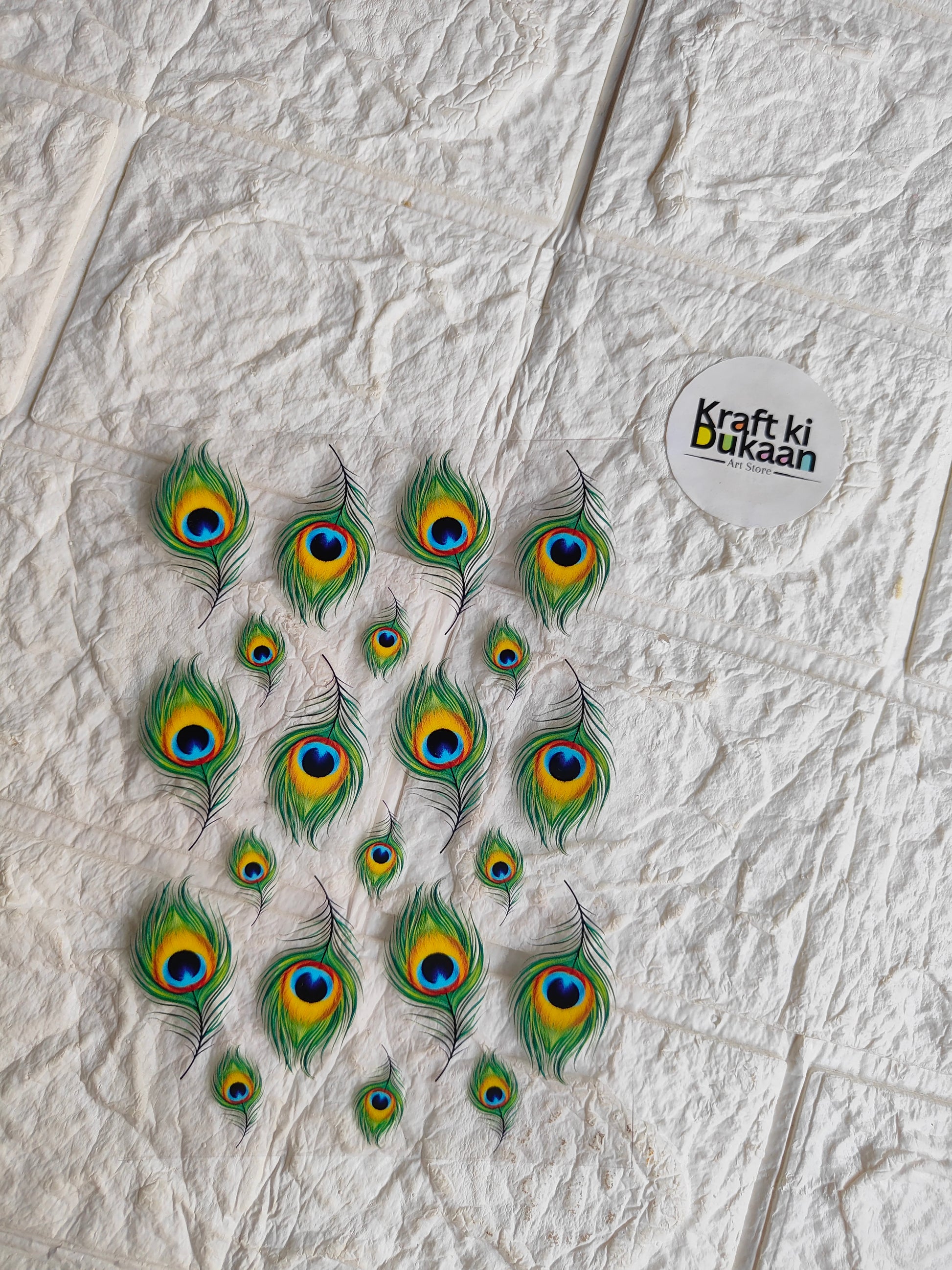 UV DTF peel-off sticker sheet with peacock feather designs, small oval decals