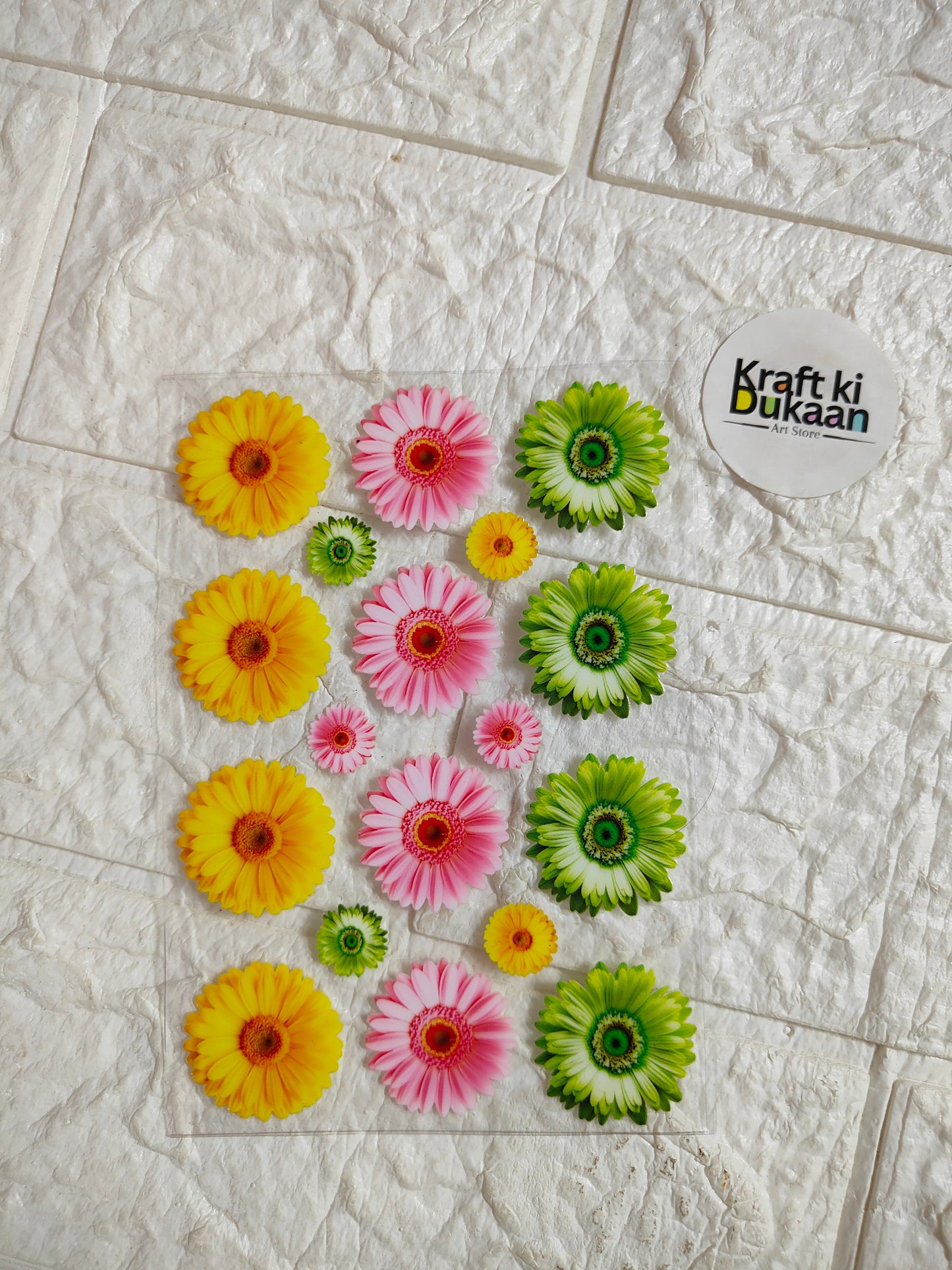 Peel-off UV DTF sticker sheet with multicolor daisy flowers in yellow, pink, and green