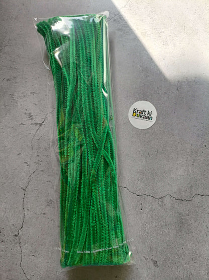 Green pipe cleaners bundle in clear packaging, fuzzy chenille texture.