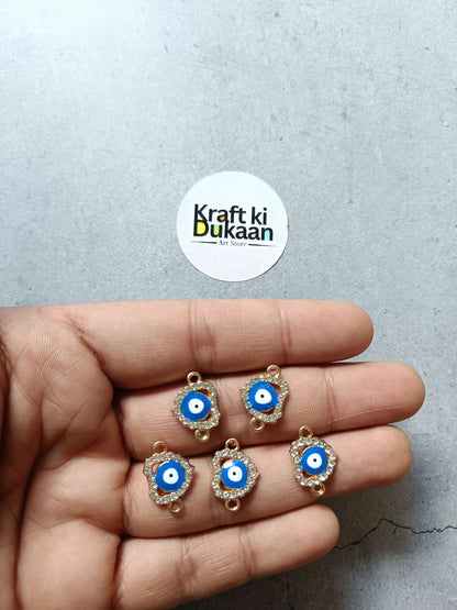 Set of five evil eye bracelet charms with blue enamel and gold-tone frames