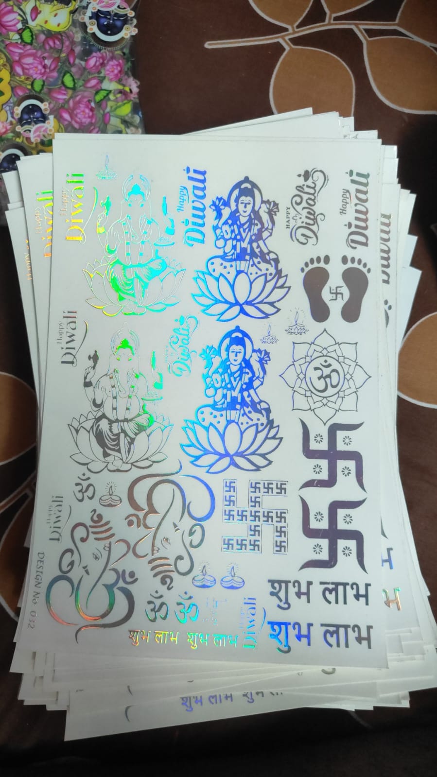Holographic sticker sheet with blue fantasy icons and figures on white backing