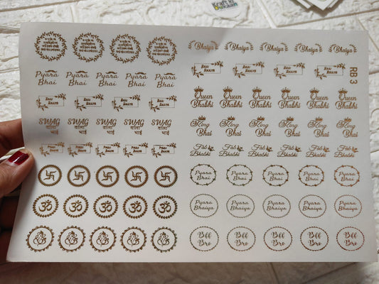 Gold-foil embossed sticker sheet with assorted circular and script labels