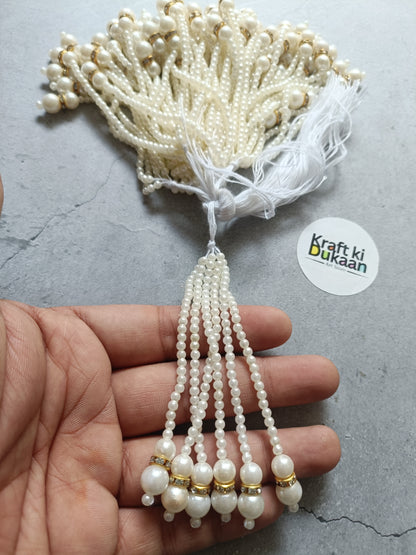 Pearl bead tassel earring with round drops and small gold-tone accents