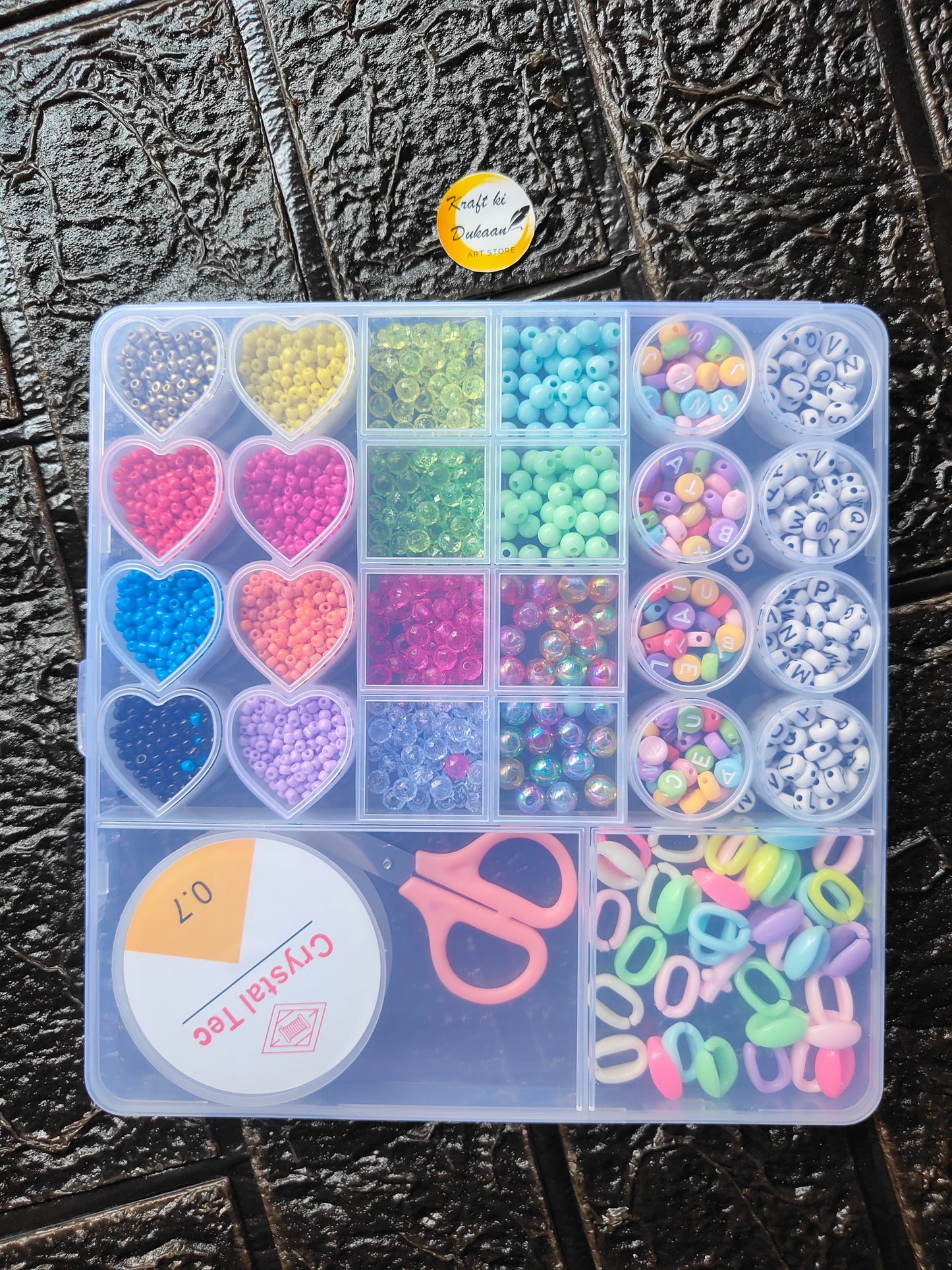 DIY bracelet beads kit tray with heart and round beads in divided compartments