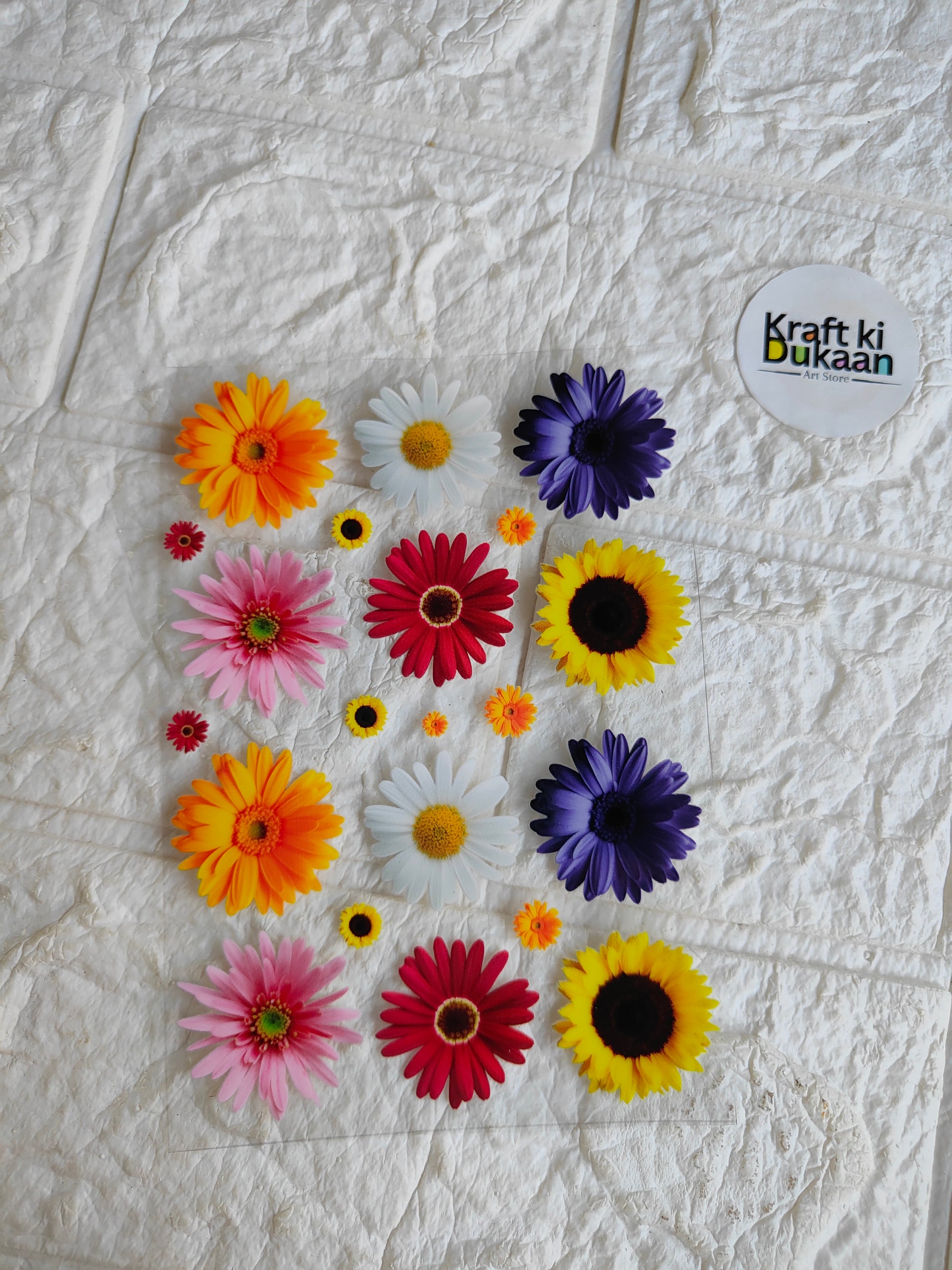 Peel-off sticker sheet with colorful daisy-like flowers and a small text logo