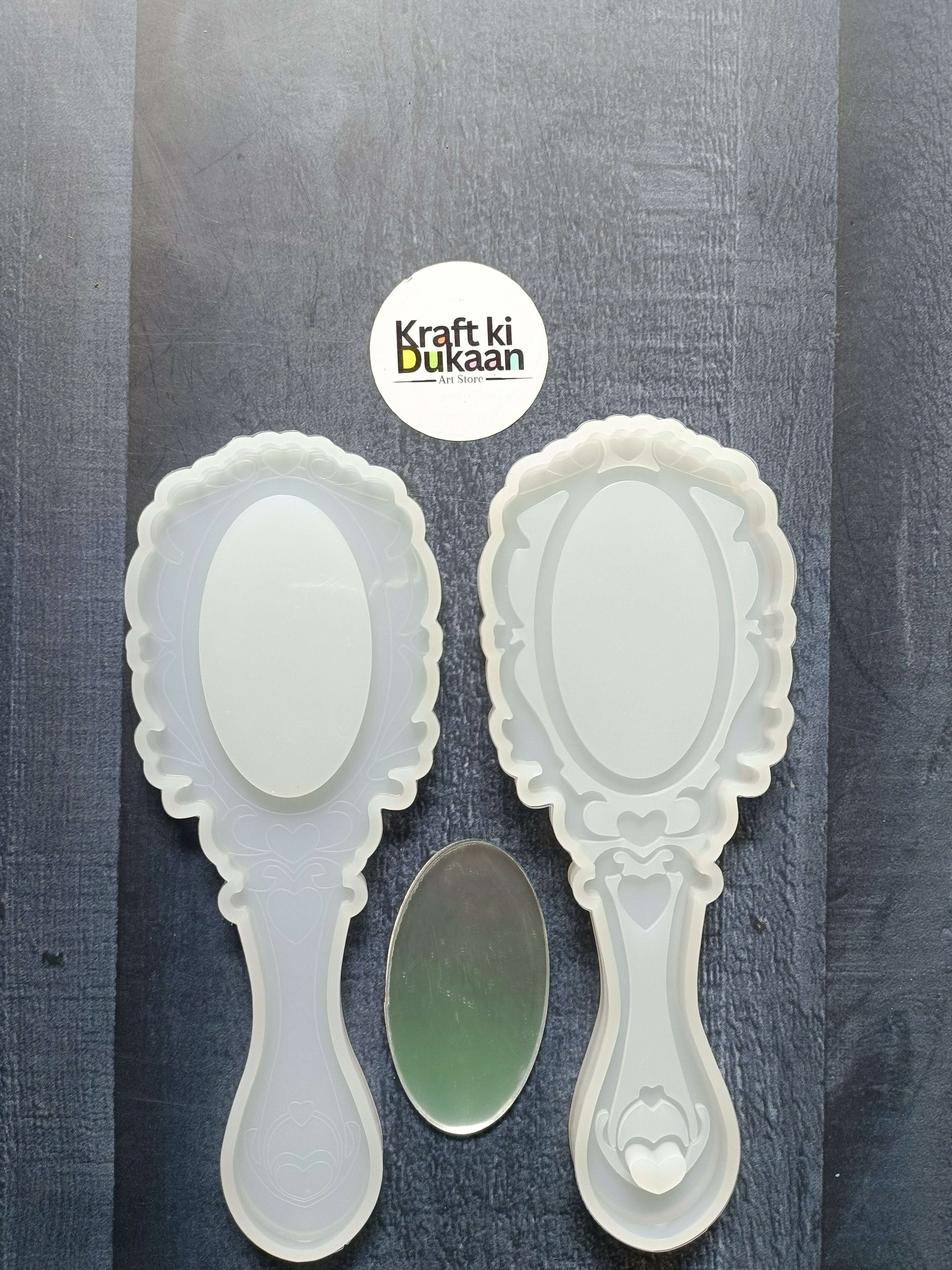 2-piece mirror mould set with two white ornate hand mirrors and oval mirror panels