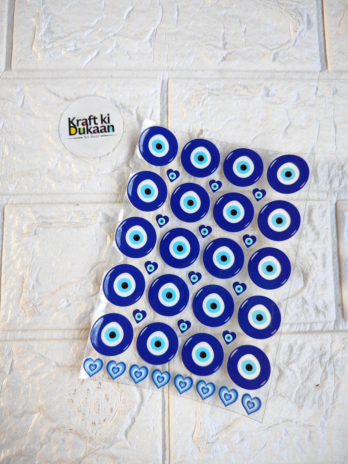 UV DTF peel-off sticker sheet with blue evil eye circle and heart motifs