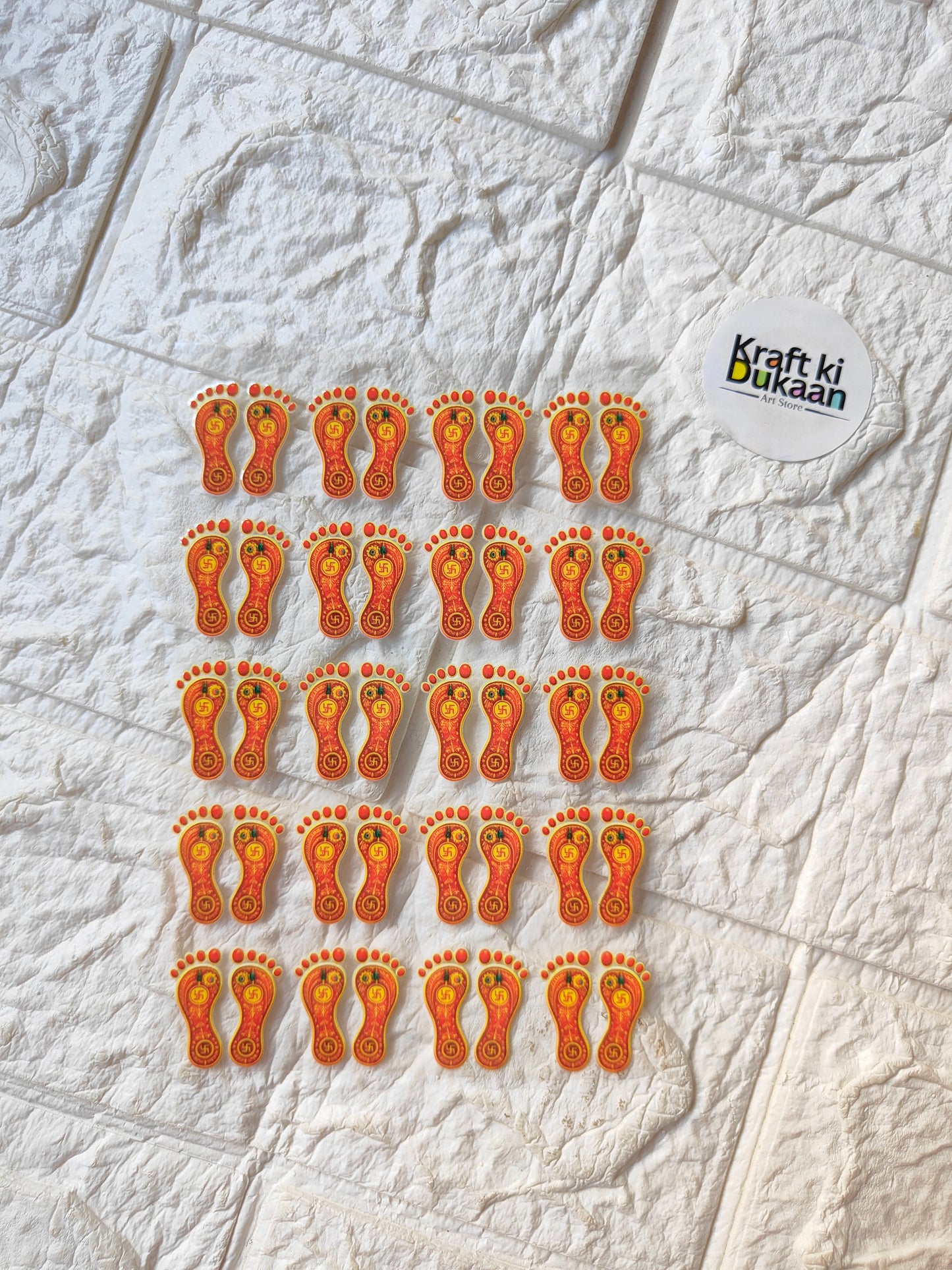 UV DTF peel-off sticker sheet with repeated orange cartoon face icons